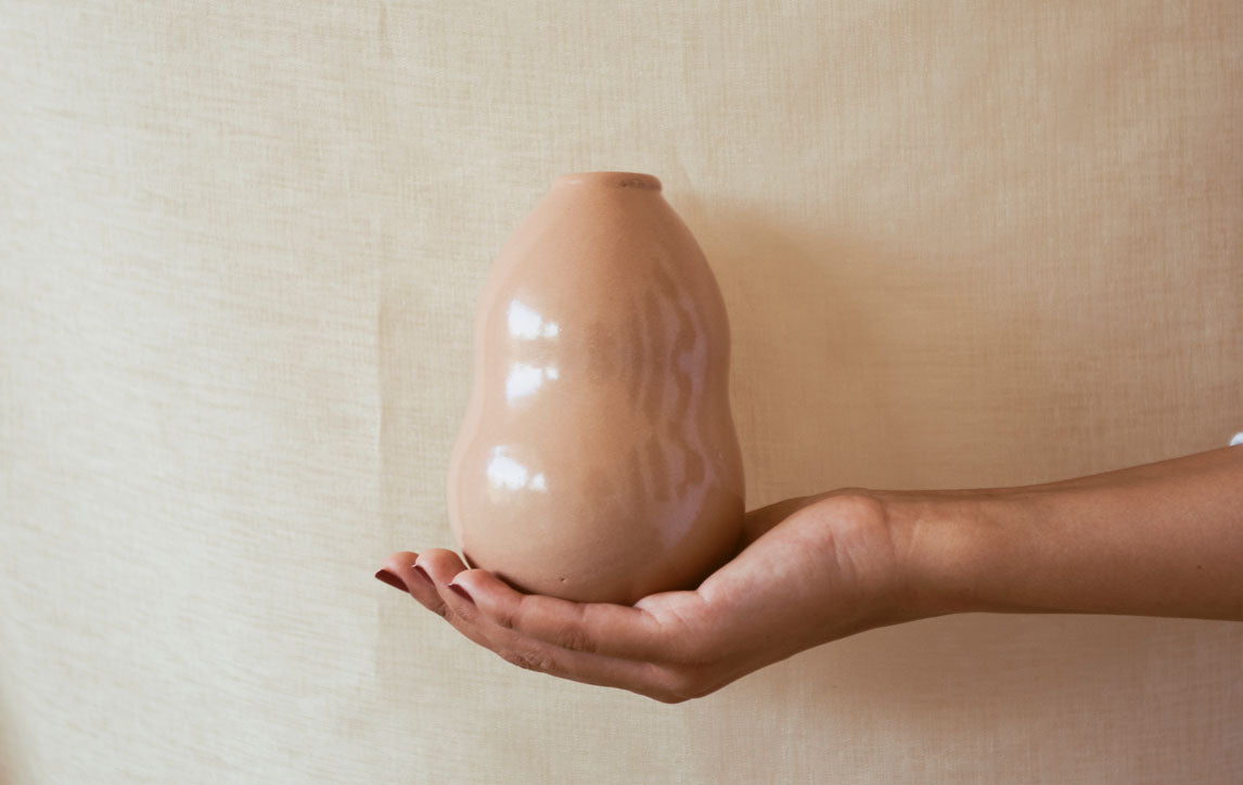 A Hand holding a Vase