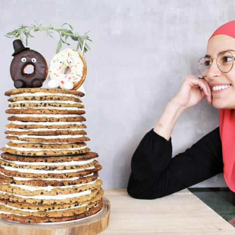 Ohoud Saad Staring at a Stack of Pies
