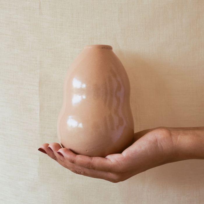 A Hand holding a Vase